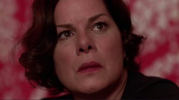 Movie still from “Detachment” (2011), directed by Tony Kaye – A person with eyes closed; Close Up shot, Over the shoulder angle