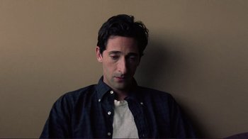 Movie still from “Detachment” (2011), directed by Tony Kaye – A young man in a blue button up shirt; Close Up shot, High angle