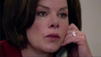 Movie still from “Detachment” (2011), directed by Tony Kaye – A person talking on a phone; Close Up shot, High angle