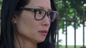 Movie still from “Detachment” (2011), directed by Tony Kaye – A person wearing glasses and looking to the side; Close Up shot, Low angle