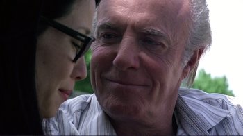 Movie still from “Detachment” (2011), directed by Tony Kaye – An older man and a younger woman looking at each other; Close Up shot, Low angle