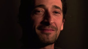 Movie still from “Detachment” (2011), directed by Tony Kaye – A man's face in the dark; Extreme Close Up shot, Low angle