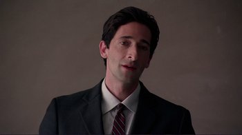 Movie still from “Detachment” (2011), directed by Tony Kaye – A man wearing a suit and tie; Close Up shot, Low angle