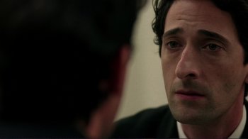 Movie still from “Detachment” (2011), directed by Tony Kaye – A person looking at a mirror; Close Up shot, Over the shoulder angle