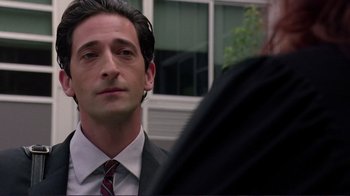 Movie still from “Detachment” (2011), directed by Tony Kaye – A man in a suit and a tie; Close Up shot, Over the shoulder angle