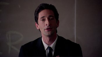Movie still from “Detachment” (2011), directed by Tony Kaye – A person wearing a suit and tie; Close Up shot, Low angle