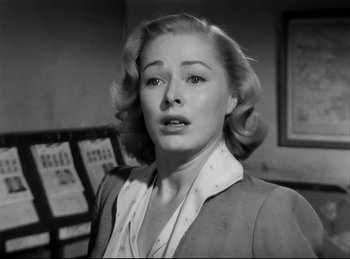 Movie still from “Detective Story” (1951), directed by William Wyler – A black and white photo of a woman in a room; Close Up shot, Low angle