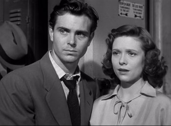 Movie still from “Detective Story” (1951), directed by William Wyler – A black and white photo of a man and a woman; Close Up shot, Low angle