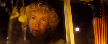 Movie still from “Detroit Rock City” (1999), directed by Adam Rifkin – An older woman looking out of a bus window; Close Up shot, Low angle