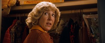 Movie still from “Detroit Rock City” (1999), directed by Adam Rifkin – An older woman with blonde curly hair looking up; Close Up shot, Low angle