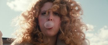 Movie still from “Detroit Rock City” (1999), directed by Adam Rifkin – A person blowing a bubble with a chewing gum; Close Up shot, Low angle