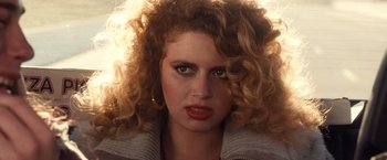 Movie still from “Detroit Rock City” (1999), directed by Adam Rifkin – A person with curly hair; Close Up shot, Over the shoulder angle