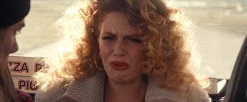 Movie still from “Detroit Rock City” (1999), directed by Adam Rifkin – A person with curly red hair; Close Up shot, Over the shoulder angle