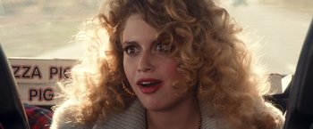 Movie still from “Detroit Rock City” (1999), directed by Adam Rifkin – A person with curly blonde hair; Close Up shot, Over the shoulder angle