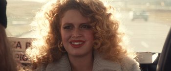 Movie still from “Detroit Rock City” (1999), directed by Adam Rifkin – A person with curly red hair; Close Up shot, Over the shoulder angle