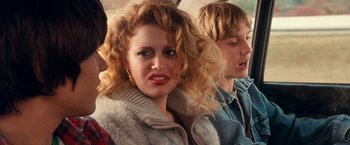 Movie still from “Detroit Rock City” (1999), directed by Adam Rifkin – A person with curly red hair; Close Up shot, Over the shoulder angle