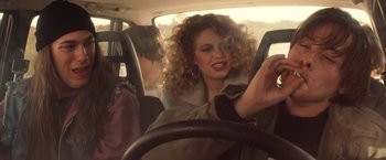 Movie still from “Detroit Rock City” (1999), directed by Adam Rifkin – A woman sitting in the driver's seat of a car; Close Up shot, Over the shoulder angle