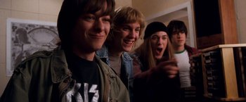 Movie still from “Detroit Rock City” (1999), directed by Adam Rifkin – A group of young people standing next to each other; Medium shot, Low angle