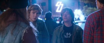 Movie still from “Detroit Rock City” (1999), directed by Adam Rifkin – A couple of young men standing next to each other; Medium shot, Over the shoulder angle