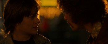 Movie still from “Detroit Rock City” (1999), directed by Adam Rifkin – A man and a woman face to face at night; Close Up shot, Over the shoulder angle