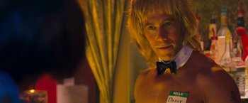 Movie still from “Detroit Rock City” (1999), directed by Adam Rifkin – A man with blonde hair and a bow tie; Close Up shot, Over the shoulder angle