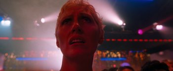 Movie still from “Detroit Rock City” (1999), directed by Adam Rifkin – A woman's face in a dark room; Close Up shot, Low angle