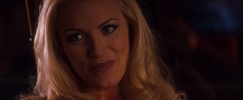 Movie still from “Detroit Rock City” (1999), directed by Adam Rifkin – A woman's face in the dark; Close Up shot, Over the shoulder angle