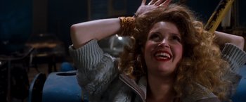 Movie still from “Detroit Rock City” (1999), directed by Adam Rifkin – A person holding their hair up; Close Up shot, Low angle