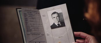 Movie still from “Diamonds Are Forever” (1971), directed by Guy Hamilton – An old photo of an older man in a suit and tie; Extreme Close Up shot, Low angle