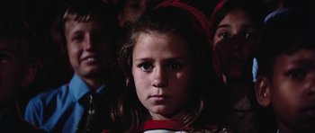 Movie still from “Diamonds Are Forever” (1971), directed by Guy Hamilton – A young girl is looking at the camera; Close Up shot, Low angle