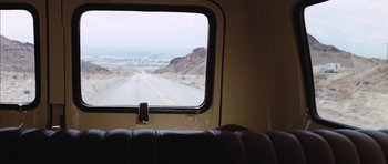 Movie still from “Diamonds Are Forever” (1971), directed by Guy Hamilton – A view of a road from inside a vehicle; Wide shot, High angle