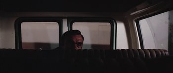 Movie still from “Diamonds Are Forever” (1971), directed by Guy Hamilton – A man sitting on a bus looking out the window; Medium shot, Over the shoulder angle