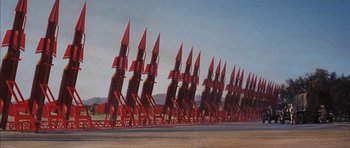 Movie still from “Diamonds Are Forever” (1971), directed by Guy Hamilton – A bunch of rockets are lined up in a row; Extreme Wide shot, Low angle