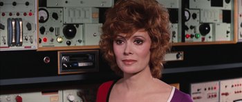 Movie still from “Diamonds Are Forever” (1971), directed by Guy Hamilton – A person wearing a red and white shirt; Close Up shot, Over the shoulder angle