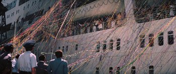 Movie still from “Diamonds Are Forever” (1971), directed by Guy Hamilton – A group of people standing on top of a white building; Extreme Wide shot, High angle