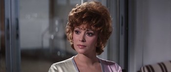 Movie still from “Diamonds Are Forever” (1971), directed by Guy Hamilton – A person wearing a suit and tie; Close Up shot, Over the shoulder angle