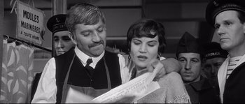 Movie still from “Diary of a Chambermaid” (1964), directed by Luis Buñuel – A man and a woman looking at a piece of paper; Close Up shot, Low angle