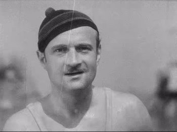 Movie still from “Diary of a Lost Girl” (1929), directed by Georg Wilhelm Pabst – An old black and white photo of a man with a mustache; Close Up shot, Low angle