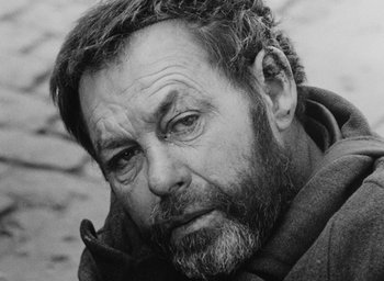 Movie still from “Diary of a Pregnant Woman” (1958), directed by Agnès Varda – Black and white photograph of a man with a beard; Close Up shot, High angle