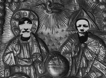 Movie still from “Diary of a Pregnant Woman” (1958), directed by Agnès Varda – A black and white photo of two people and a globe; Extreme Close Up shot, Overhead angle