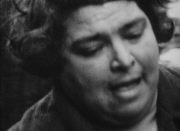 Movie still from “Diary of a Pregnant Woman” (1958), directed by Agnès Varda – A black - and - white photo of a woman's face; Extreme Close Up shot, Low angle