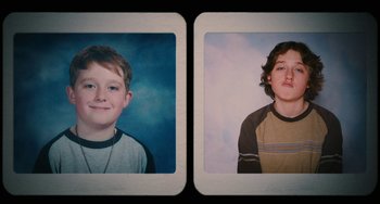 Movie still from “Diary of a Wimpy Kid” (2010), directed by Thor Freudenthal – Two pictures of a young boy in a photo booth; Close Up shot, Overhead angle