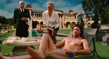 Movie still from “Diary of a Wimpy Kid” (2010), directed by Thor Freudenthal – A man laying on a lounge chair next to a woman; Wide shot, Over the shoulder angle