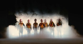 Movie still from “Diary of a Wimpy Kid” (2010), directed by Thor Freudenthal – A group of men standing next to each other in the fog; Extreme Wide shot, Low angle
