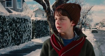 Movie still from “Diary of a Wimpy Kid” (2010), directed by Thor Freudenthal – A young boy wearing a hat and a scarf in the snow; Close Up shot, Over the shoulder angle