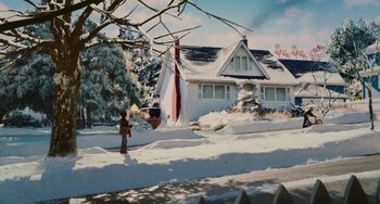 Movie still from “Diary of a Wimpy Kid” (2010), directed by Thor Freudenthal – A person standing in front of a snow covered house; Extreme Wide shot, High angle