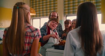 Movie still from “Diary of a Wimpy Kid” (2010), directed by Thor Freudenthal – A group of people standing in a room; Medium shot, Over the shoulder angle