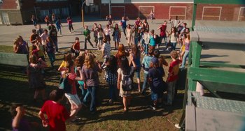 Movie still from “Diary of a Wimpy Kid” (2010), directed by Thor Freudenthal – A group of people standing in the grass; Extreme Wide shot, High angle