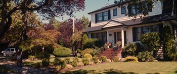 Movie still from “Diary of a Wimpy Kid: Rodrick Rules” (2011), directed by David Bowers – A house that has a lot of flowers in the yard; Extreme Wide shot, High angle