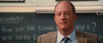 Movie still from “Diary of a Wimpy Kid: Rodrick Rules” (2011), directed by David Bowers – A person wearing a suit and tie; Close Up shot, Over the shoulder angle